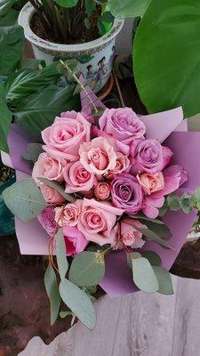 Pretty colors ($60 bouquet: ~half dozen roses, sprays, freesia?, and eucalyptus)