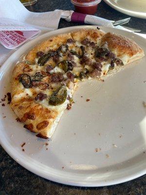 Hand tossed pizza with garlic Parmesan sauce, beef, onions and jalapeños. Yum