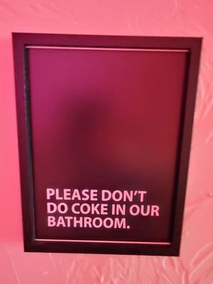 Funny sign outside the restroom.