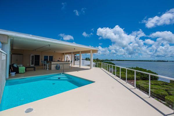 Luxurious 6-bedroom home with a 1-bed, 1-bath guest house. Private, serene location, featuring a stunning second-story concrete pool.