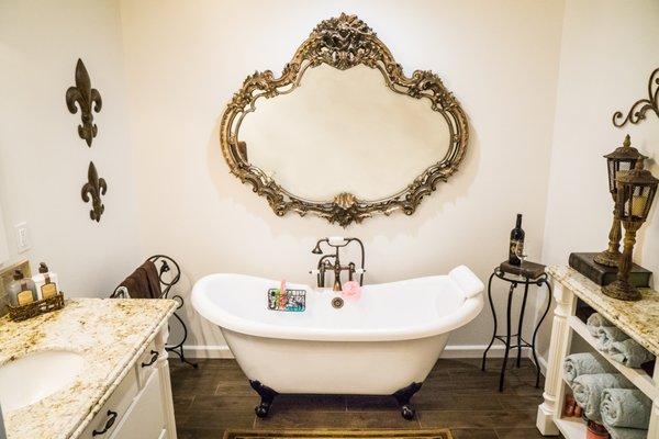 A classic clawfoot tub is the center piece in this bathroom remodel by Lawson Construction.