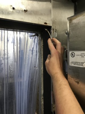 We fix broken heater wires for walk-in freezer doors and install door curtains!