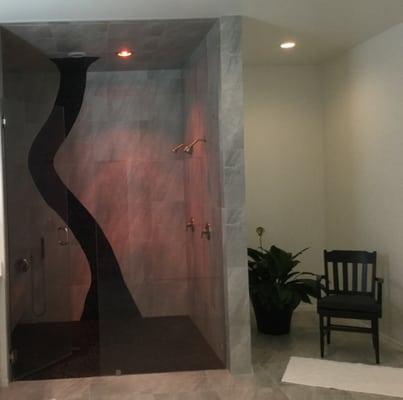 Custom walk-in shower with mexican beach stone accent