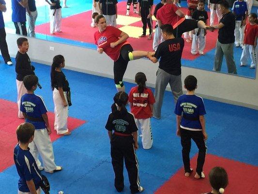 Master Song teaching Olympic style Taekwondo to local RGV athletes