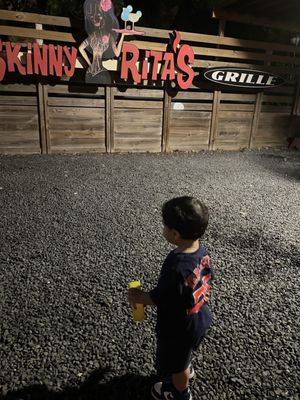 There's a area in the back with gravel. My 15mo old was just exploring.