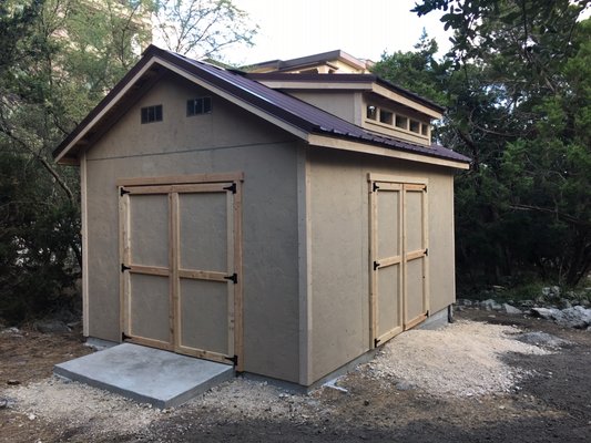 12 by 16 using LP Smartside Stucco style siding on a slab with two 6 foot doors.  8 foot dormer.