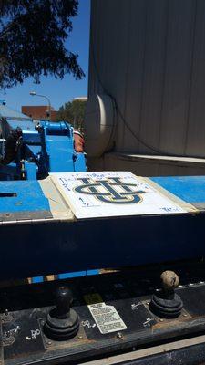 Big City Signs work in progress - hand painted graphics at UC Irvine - water tower near Bren Center north side