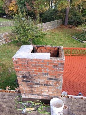 Missing flue and half Missing cement chimney crown.