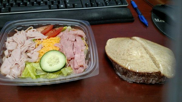 Chef salad and chicken salad sandwich on wheat