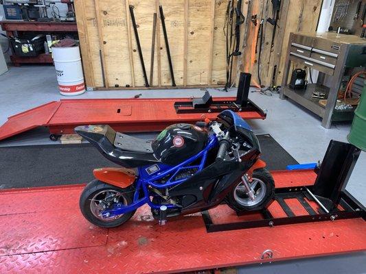 A dad brought his kid's pocket bike in because the levers were too long. We adjusted it and the little kid is able to ride much better now!