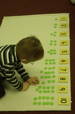 We are an authentic Montessori Program.  Here one of our students is learning the quantity of a number AND if the number is even or odd.