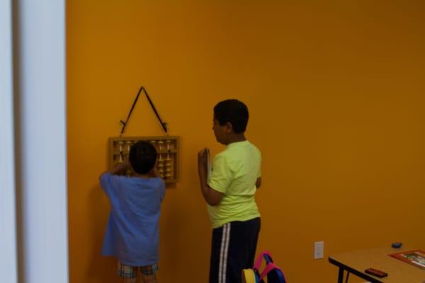 Kids learning Math on the abacus