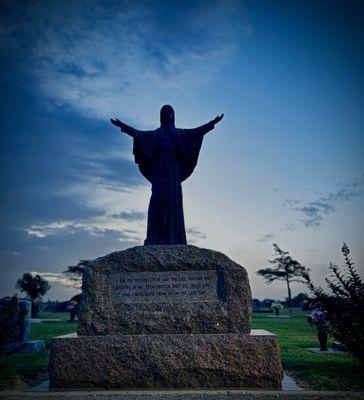 Beautiful statue of Jesus with scripture inviting all