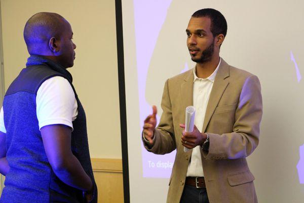 James Mwombela, CFP® talking at a Haitians of the Triangle financial workshop