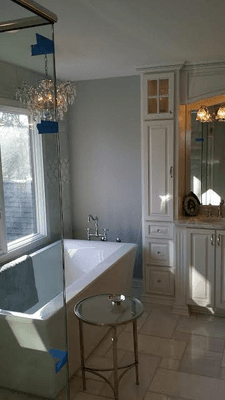 Very elegant and timeless bath. Chandeliers in bathrooms should almost be a standard equipment!