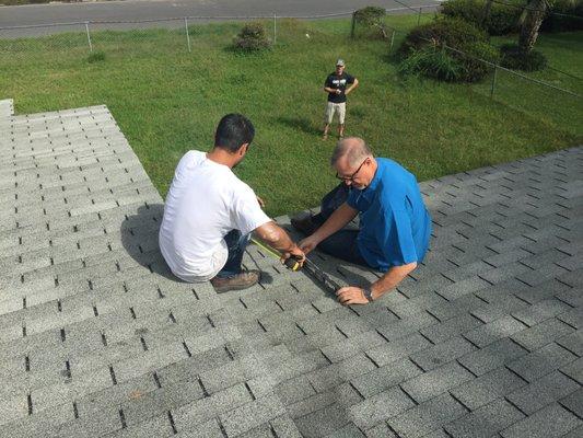 Joe measures a roof to fix a leak