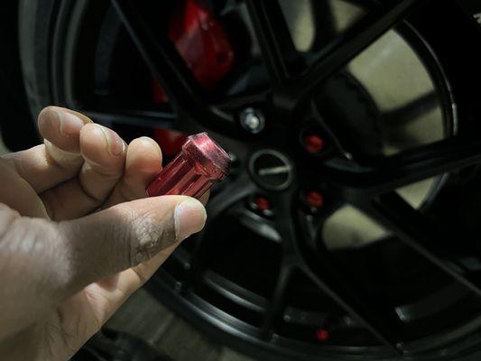 Loose lug nut removed by hand