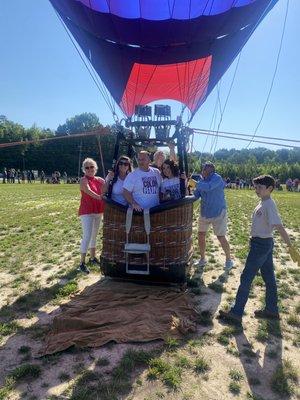 The big RE/MAX hot air balloon at Louisburg Charter School while teachers were allowed to go on a tethered ride.