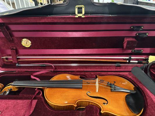 My new violin and bow. My outfit included the case, shoulder rest, and rosin.