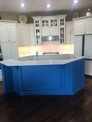 Freshly painted island.  New quartz counter/ backsplash.  Upgraded LED undercabinet lighting