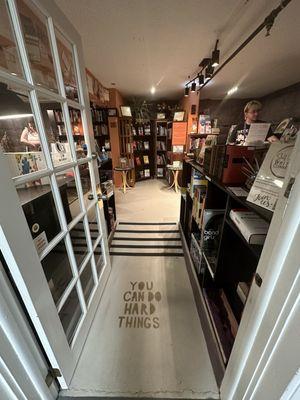 Standing at the front door, looking into the bookstore