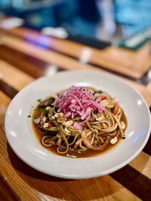 Thai peanut noodles with stir-fried veggies, pickled onions & sesame seeds. Add chicken or grilled salmon or leave as is for a vegan option!