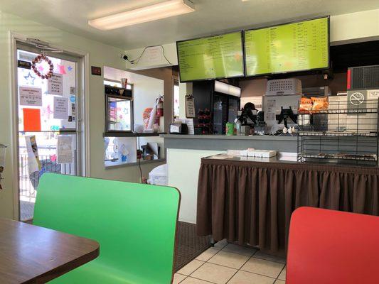 Inside, just a few tables to sit down at. This place more of a take-out restaurant.