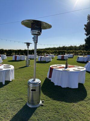 Propane heaters and round tables that seat up to 10 per table