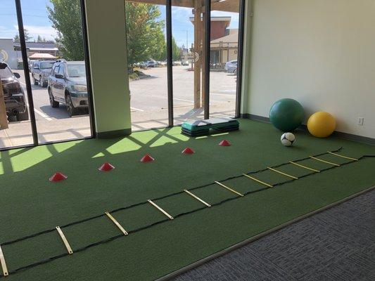 Physical Therapy open exercise area with FieldTurf