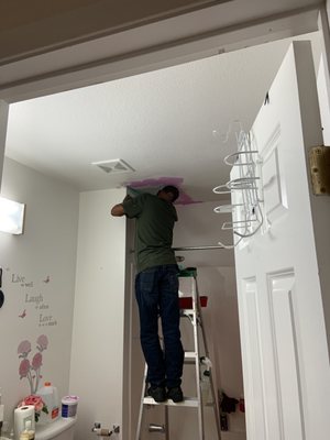 Repairing hole in ceiling after being open for two months.