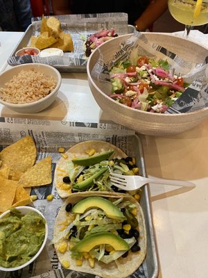 Tijuana Chop Salad, Veggie Picante Tacos, Chimi Carne Tacos, Side of Red Rice, and Side of Guacamole.