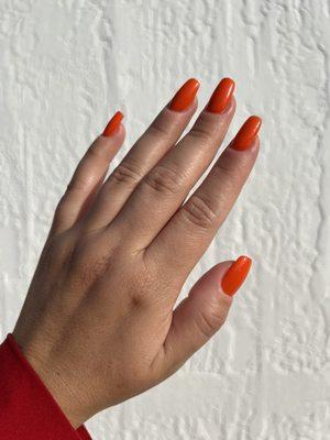 Summer gel nails with gorgeous orange shade.