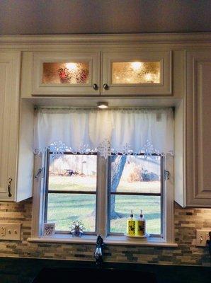 Love the lighted above sink cabinet!