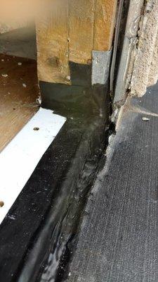 Waterproofing under the threshold of second-story doors