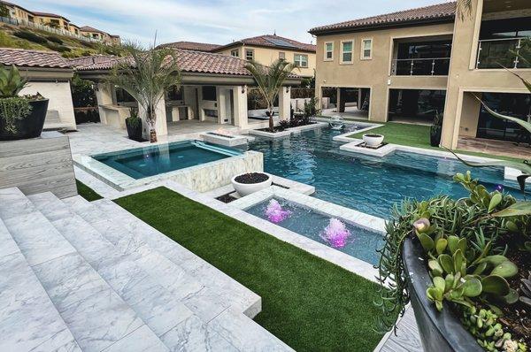 Pool with spa.
 
 Enclave Yorba Linda Project design by RMT Design Group. 
 
 Concept - Resort Type Outdoor Living Space