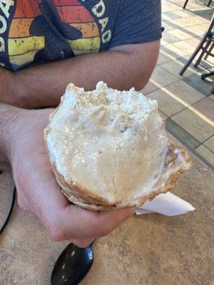 Banana pudding ice cream in a waffle cone