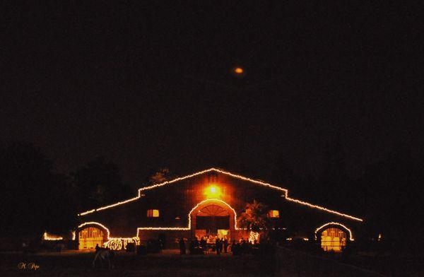 The New Barn lit up for a party, with Jupiter in the sky above.  3