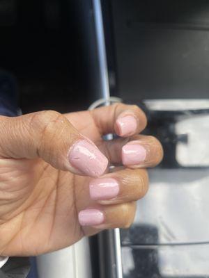 Thick nails with chipping pant and streaks.