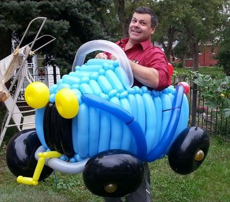 ME!  Zany the Denver balloon animals artist Inside a car I made for an event for a young man!!!