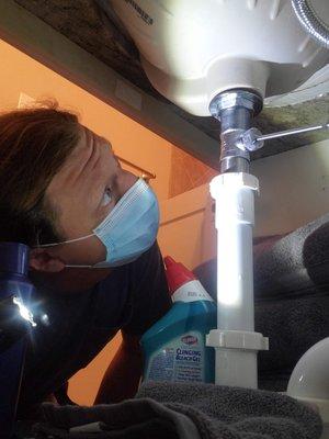 Inspecting under a sink