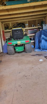 Working on repairing a lawnmower