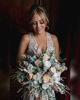 Our very special bride with her preserved rose 
 bridal bouquet.