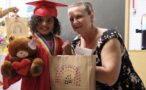 This is our awesome VPK teacher Mrs. Chris handing one of her students her diploma and a little gift to go along with it!