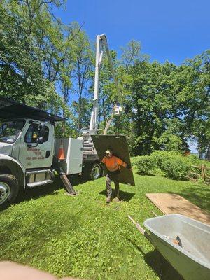 Tim putting down pads to eliminate damage to my lawn