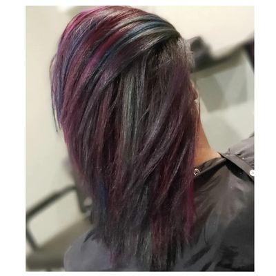 Purple, blue, pink, and green highlights on natural hait