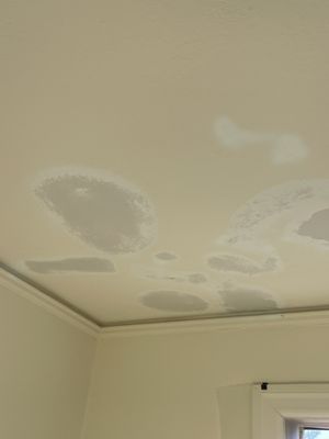 Spackled water damaged ceiling