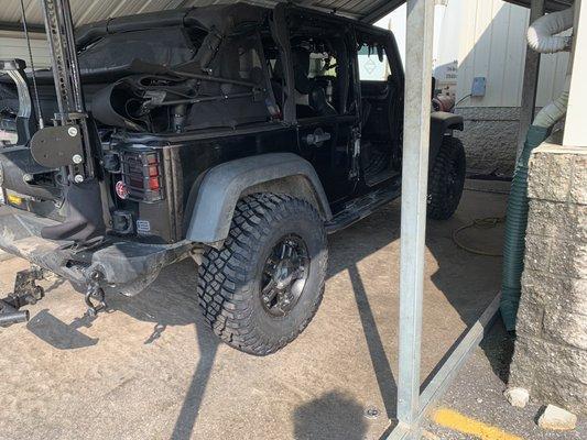 Jeep tires being mounted and balanced.