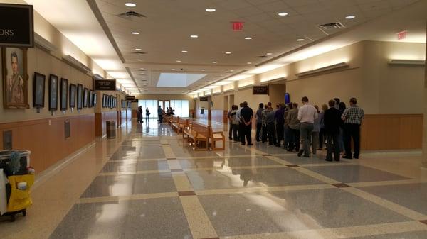 Those called out for jury duty are waiting on the baliff for instructions and to let  them in courtroom.