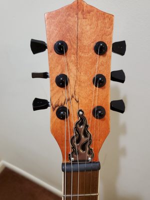 Headstock, with filed Tusk nut and lowered action.