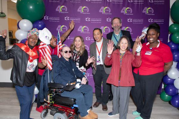 Senior leadership poses with PACE East Oakland seniors to celebrate the new space.